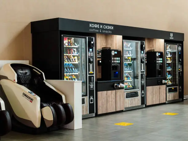 Vendingmachineforsoftdrinks-coffeeandsnacks-massagechairinthewaitingroom
