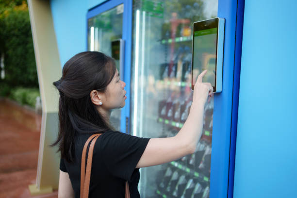 Woman using vending machine